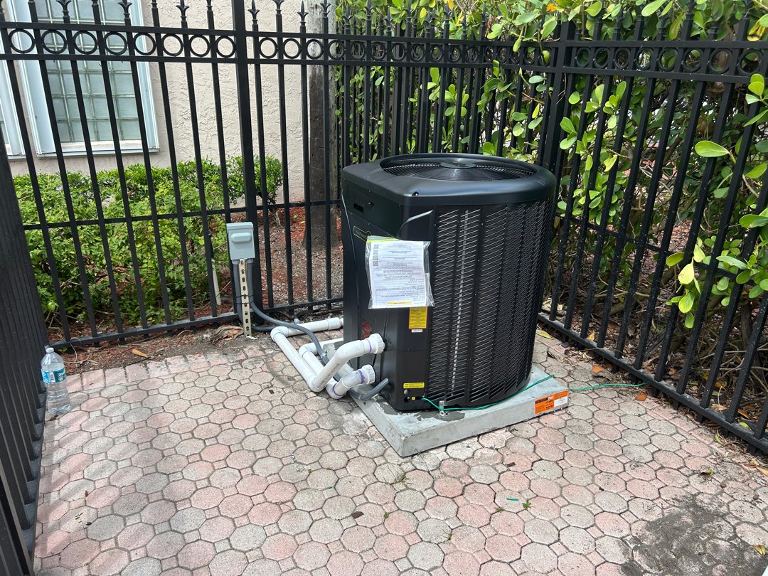 New heat pump inside a pool fence